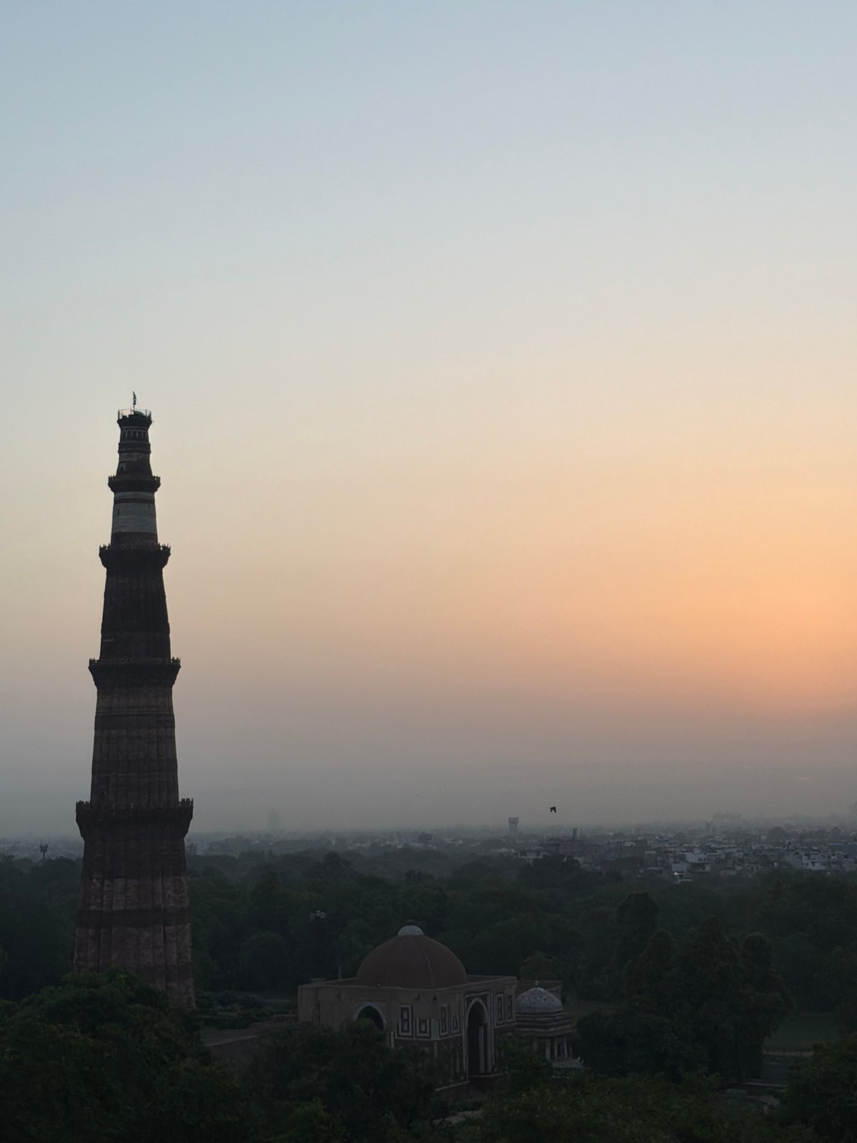 Delhi rooftops and hazy sunrise, Qutub Minar to takeoff