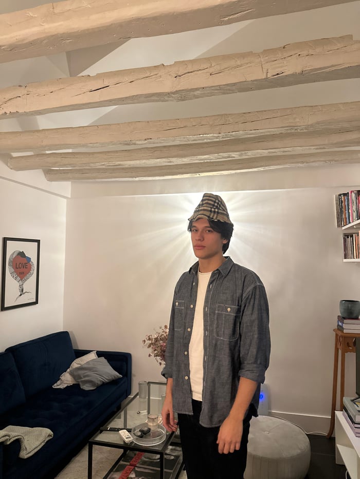 Person moves through Madrid apartment during early morning hours