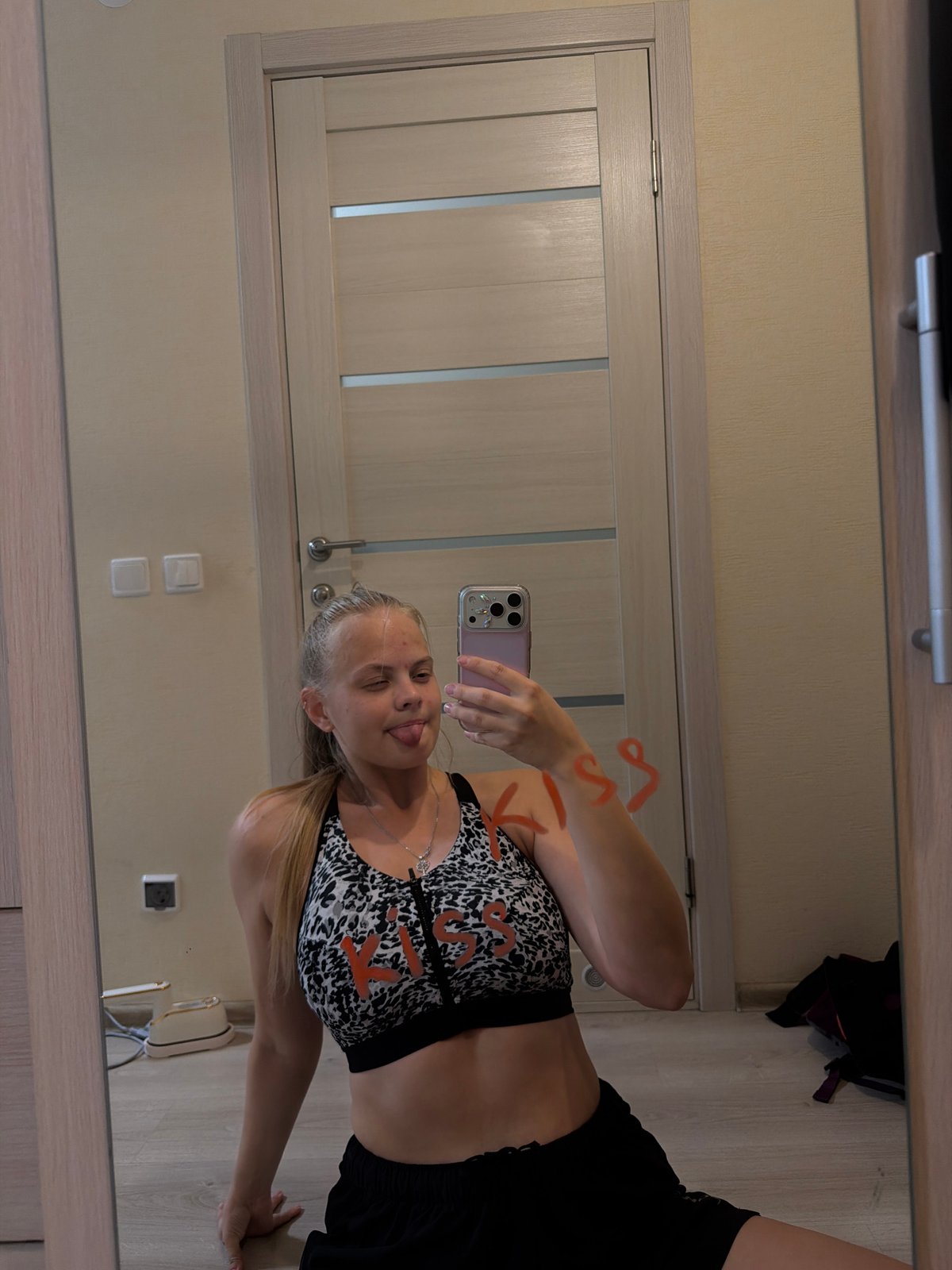 Woman documents personal photo session at Izhevsk residence