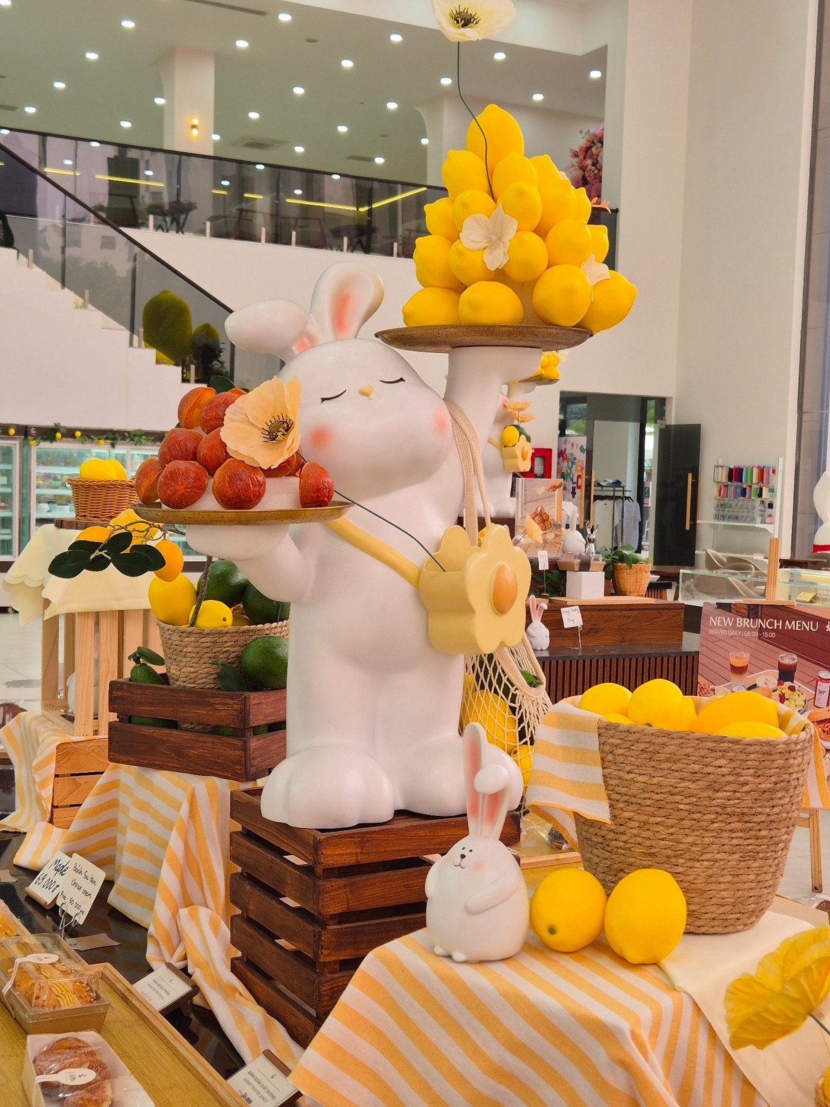 Whimsical bunny display inside a bright Da Nang bakery or cafe