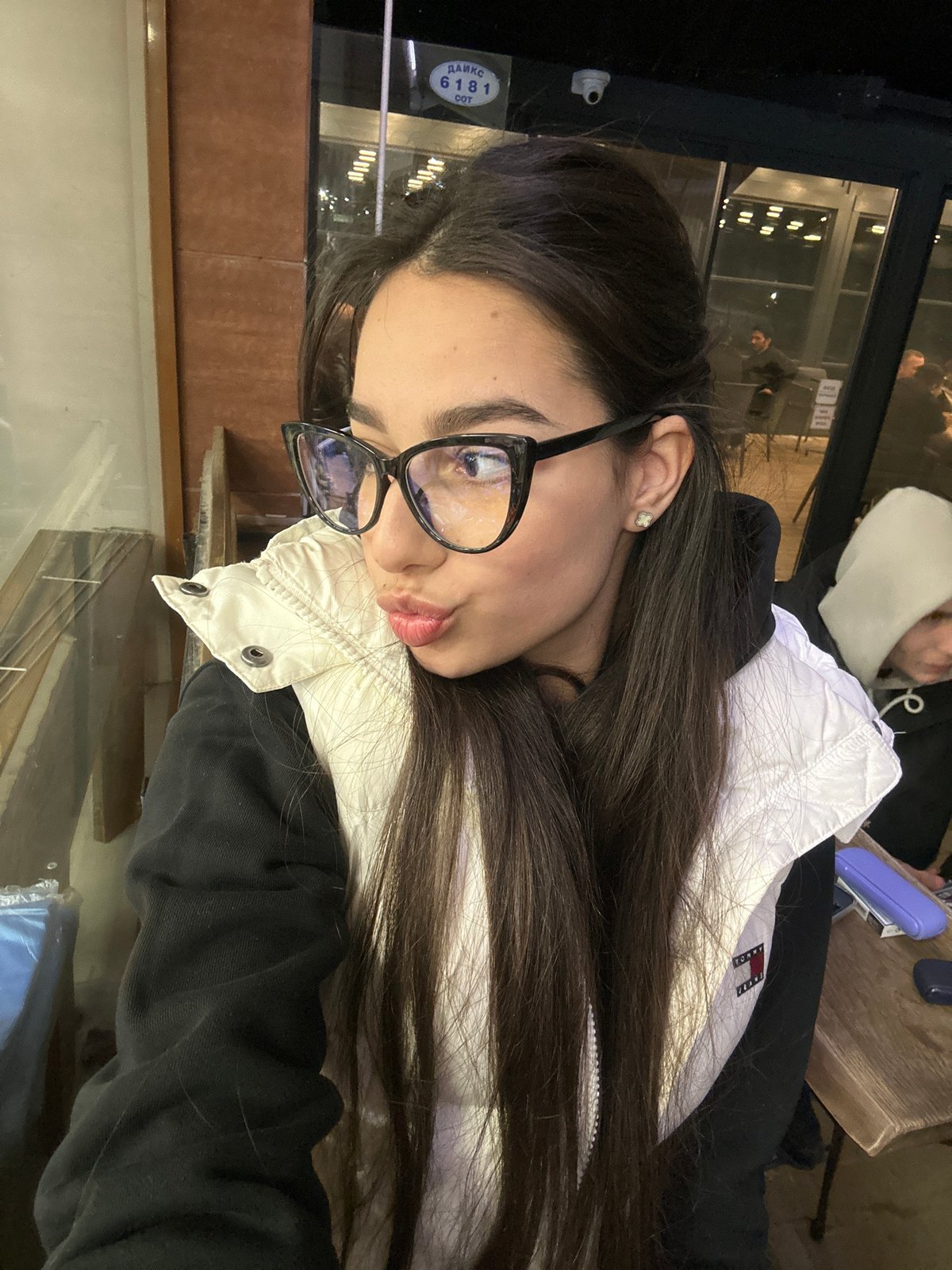 Woman takes selfies in Tommy Jeans jacket in Plovdiv