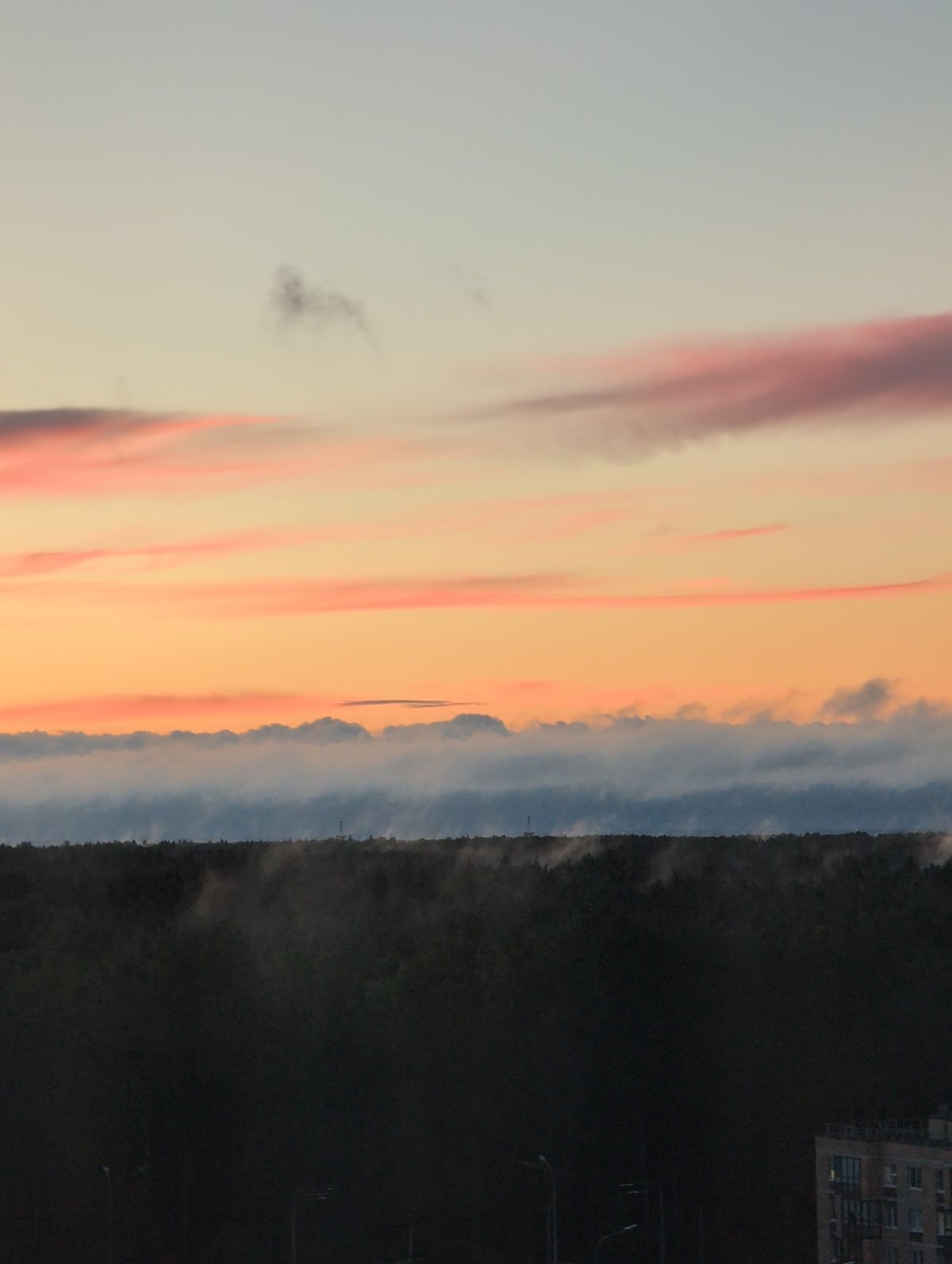 Saint Petersburg sunset paints the sky above residential blocks