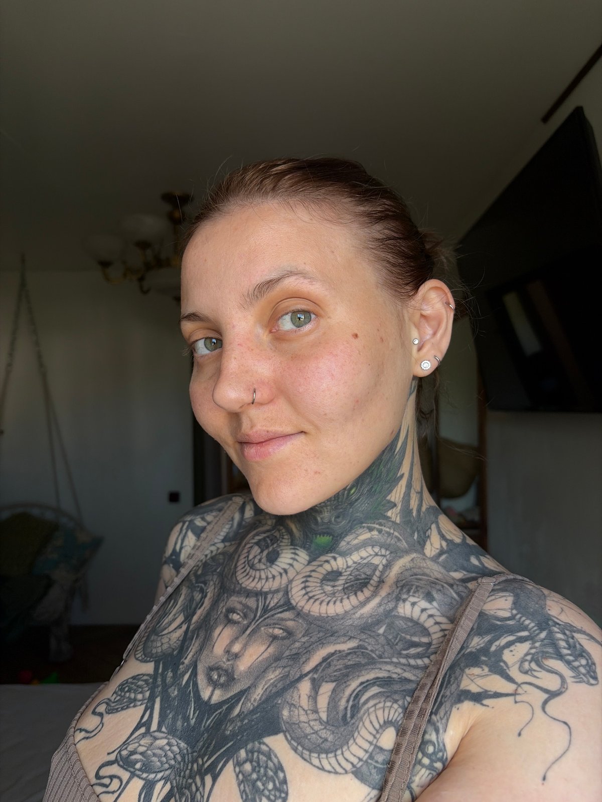 Woman documents morning routine, tattoos, water collection in Chaikovsky