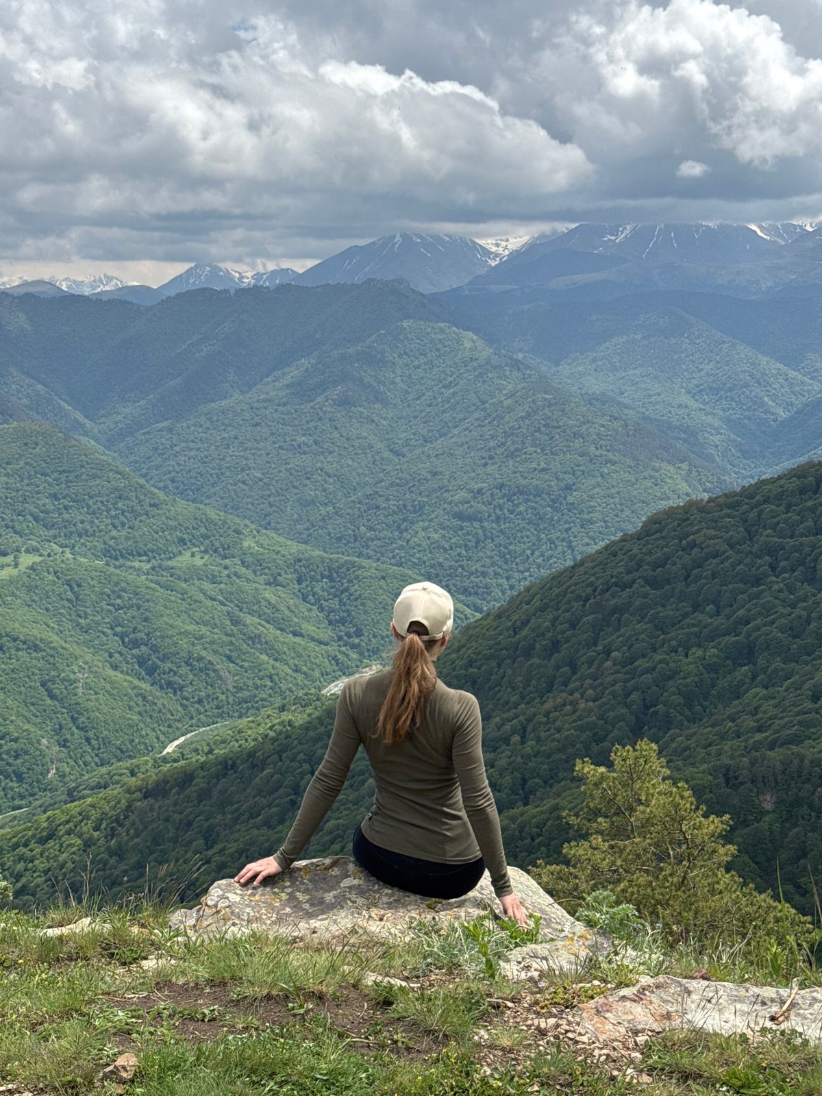 Tourists photograph mountain scenery at Russian Caucasus overlooks