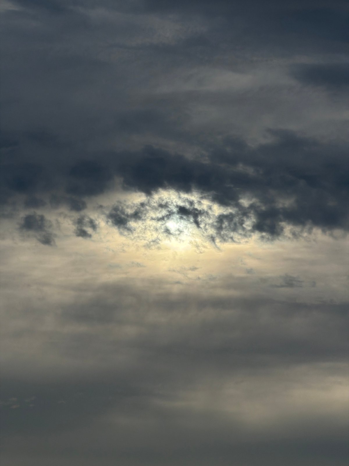 Sun breaks through dark clouds over New York