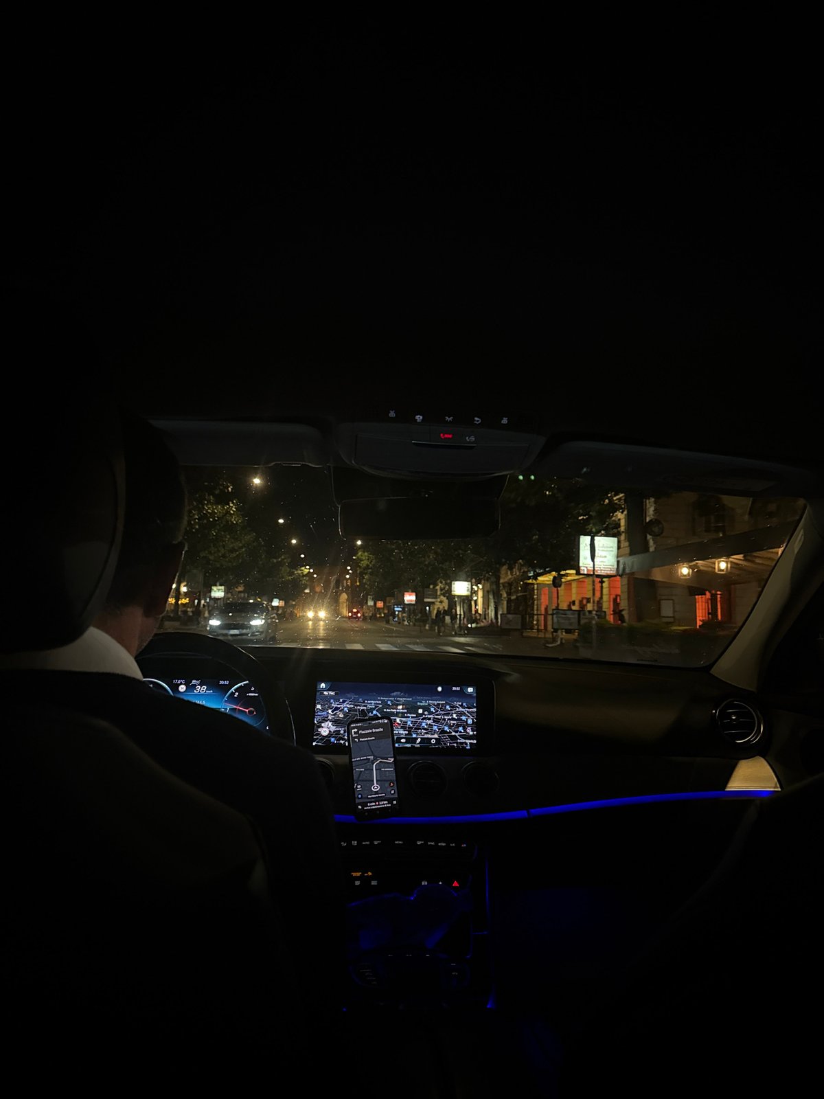 Nighttime car journey captured in Rome streets