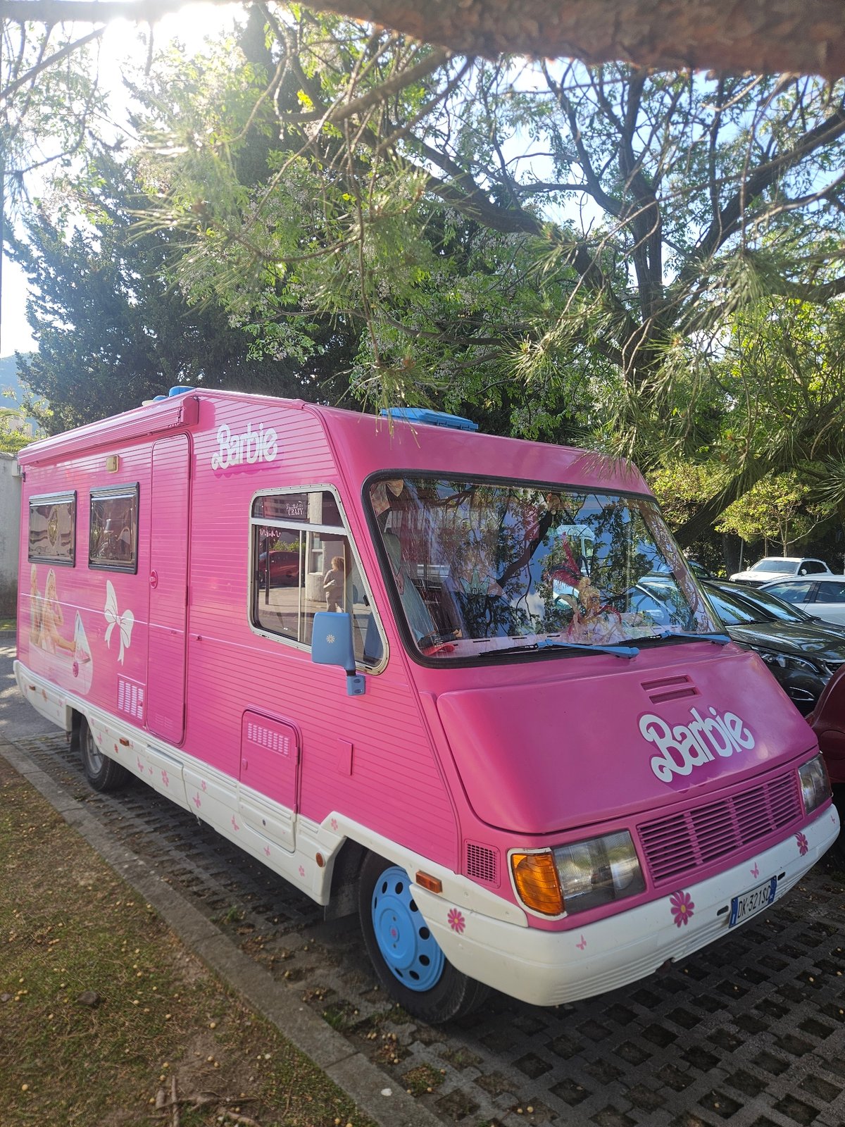 Pink Barbie camper van spotted parked on stone pavement