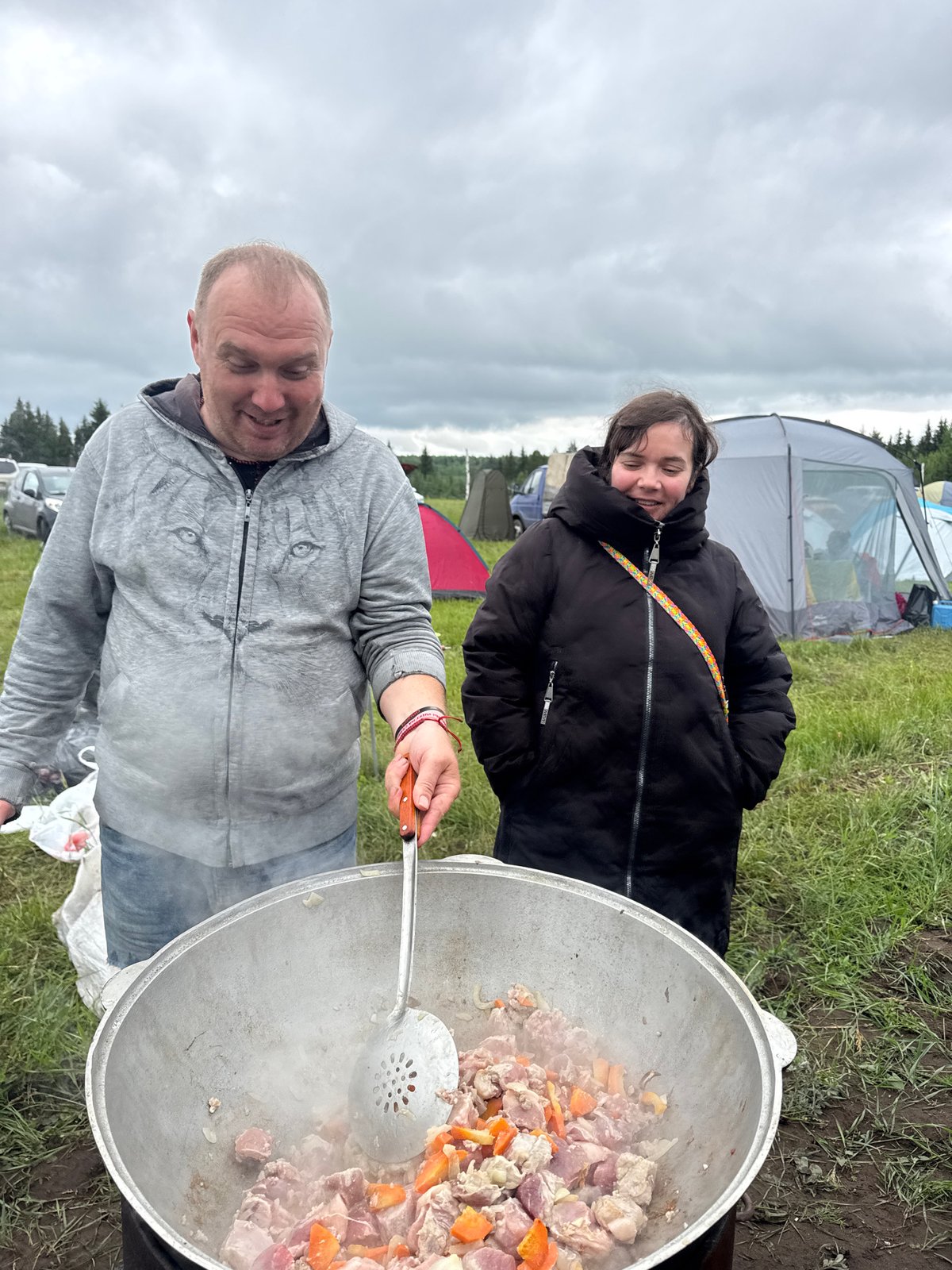 Dawn camping gathering with outdoor cooking in Большая Кивара, Russia