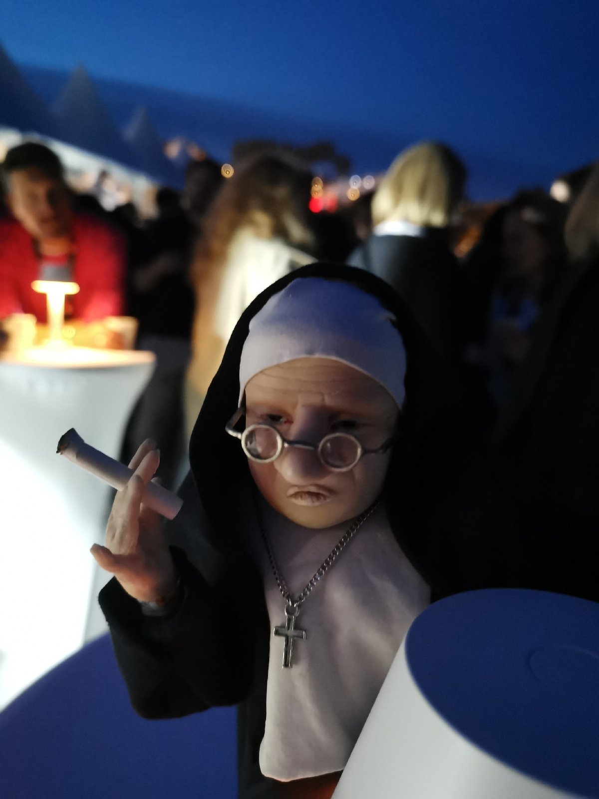 Nun-dressed doll with cigarette spotted at Cannes gatherings