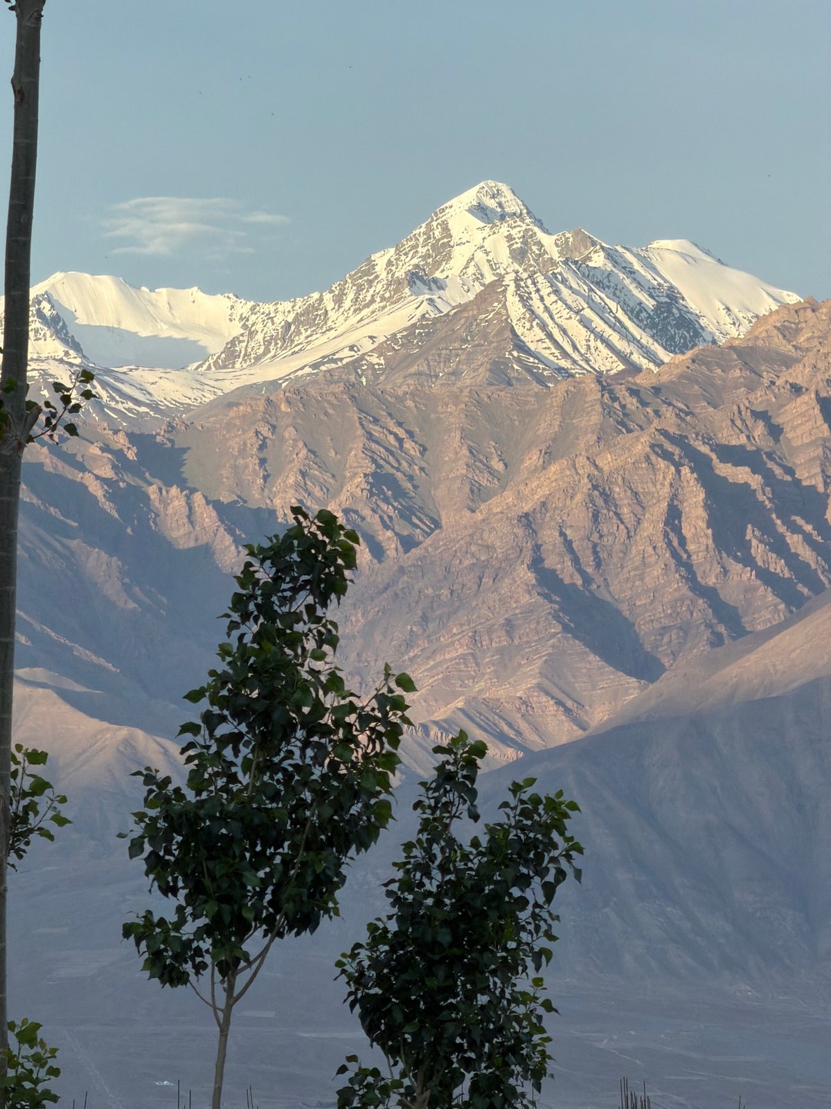 Leh from ground level: mountains, rooftops, and a helicopter