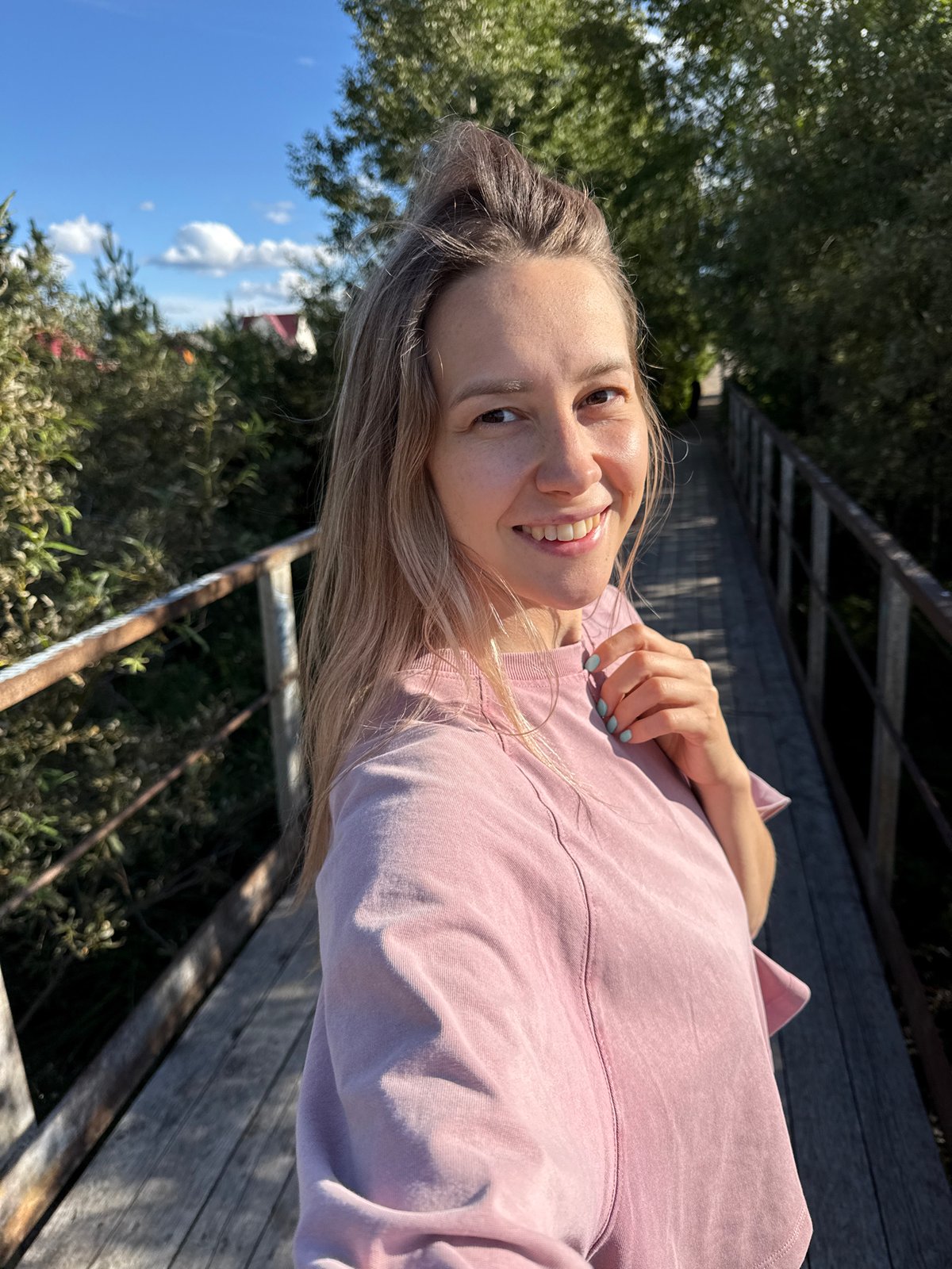 Midday scenes along a bridge and pathway in Gornozavodsk
