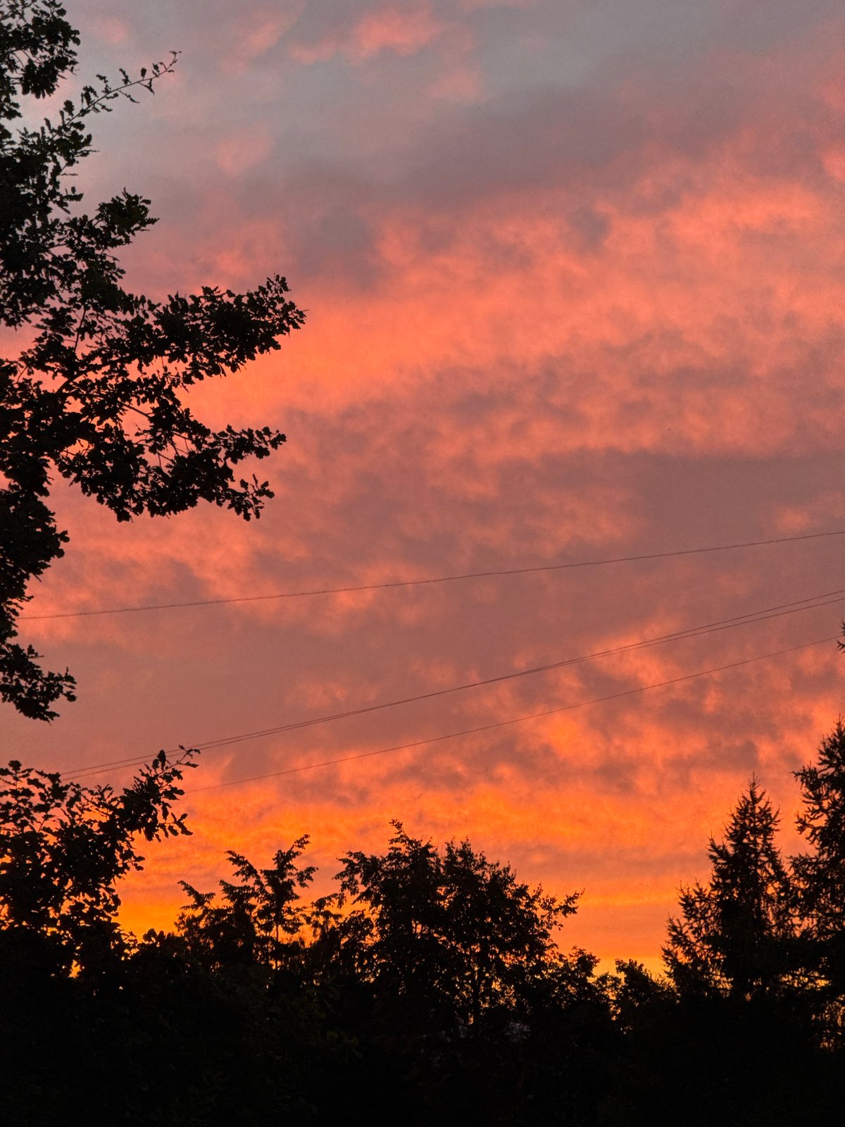 Riga skyline at sunset, sky lit orange and pink