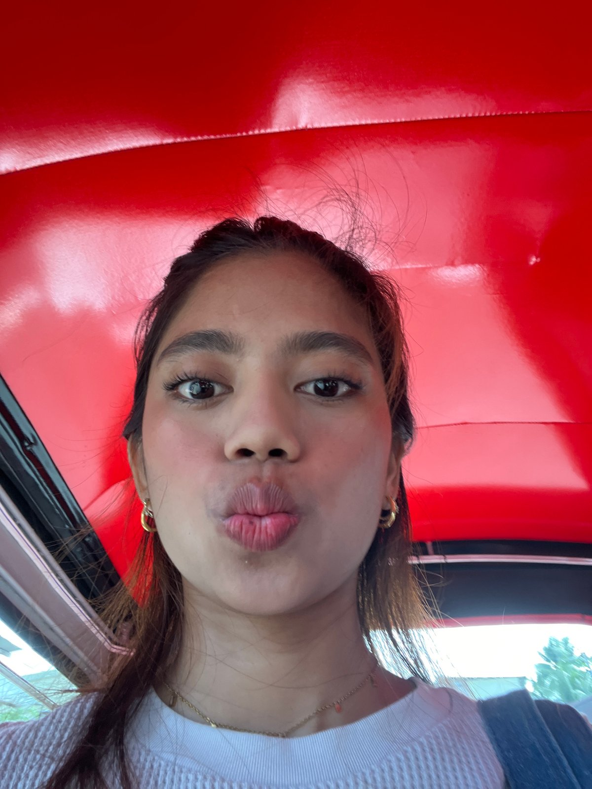Inside and outside a red tricycle in Panabo City