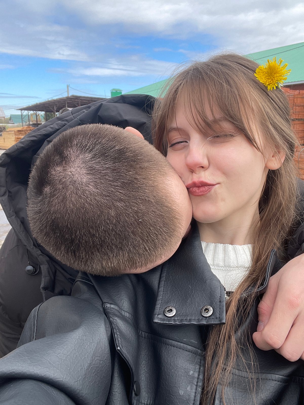 Woman photographed with dandelion flowers in early morning Karmaskaly scene
