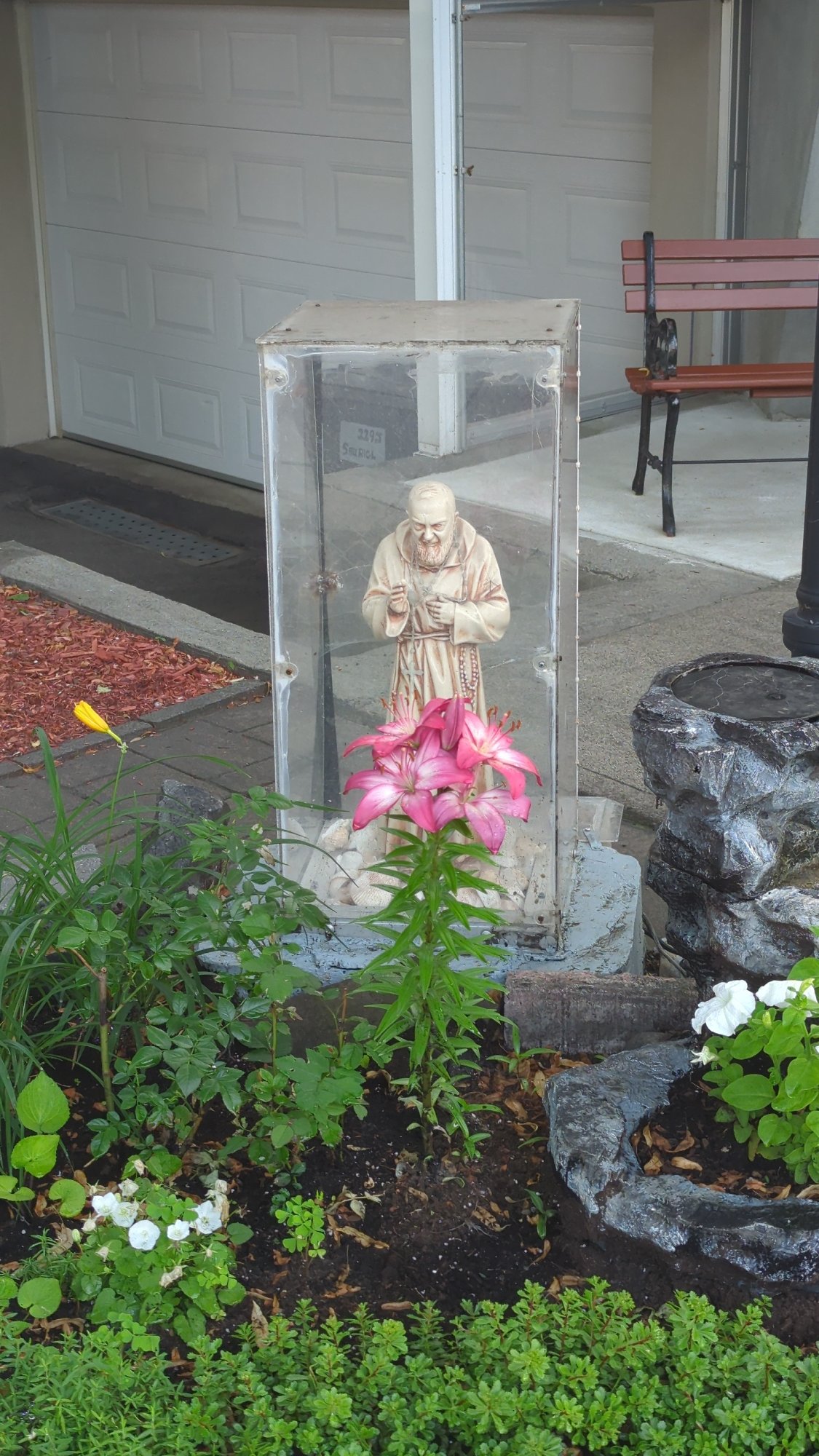 Saint Francis statue in plexiglass shrine, Montreal