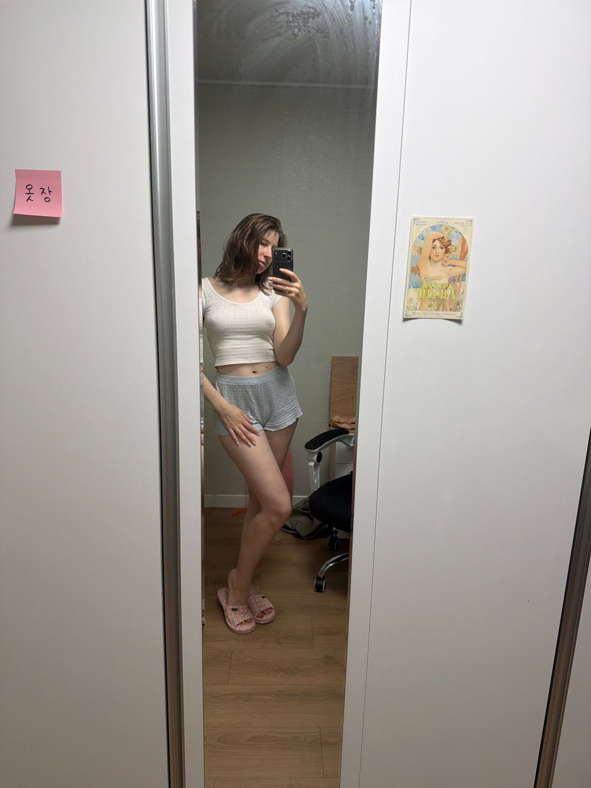 Indoor selfie session in Dongducheon-si with an Alphonse Mucha postcard