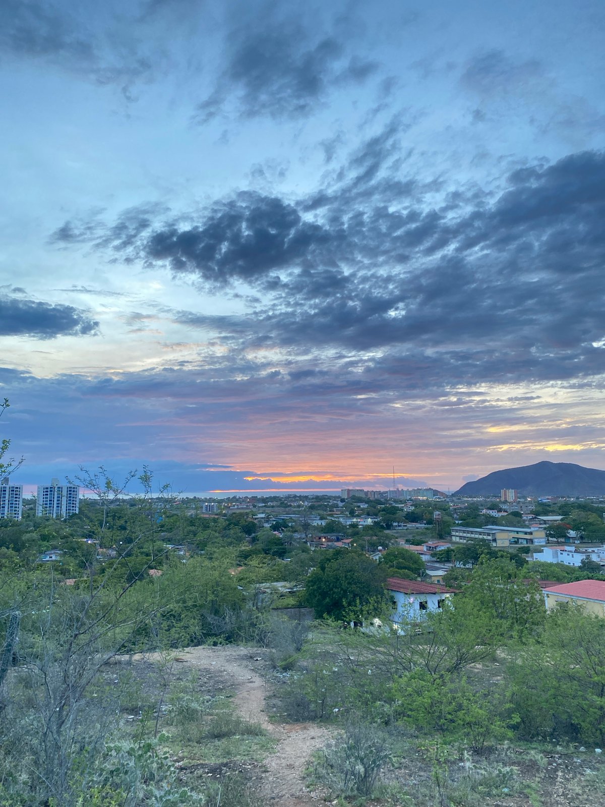 Sunset over Juan Griego, with a puppy cameo nearby