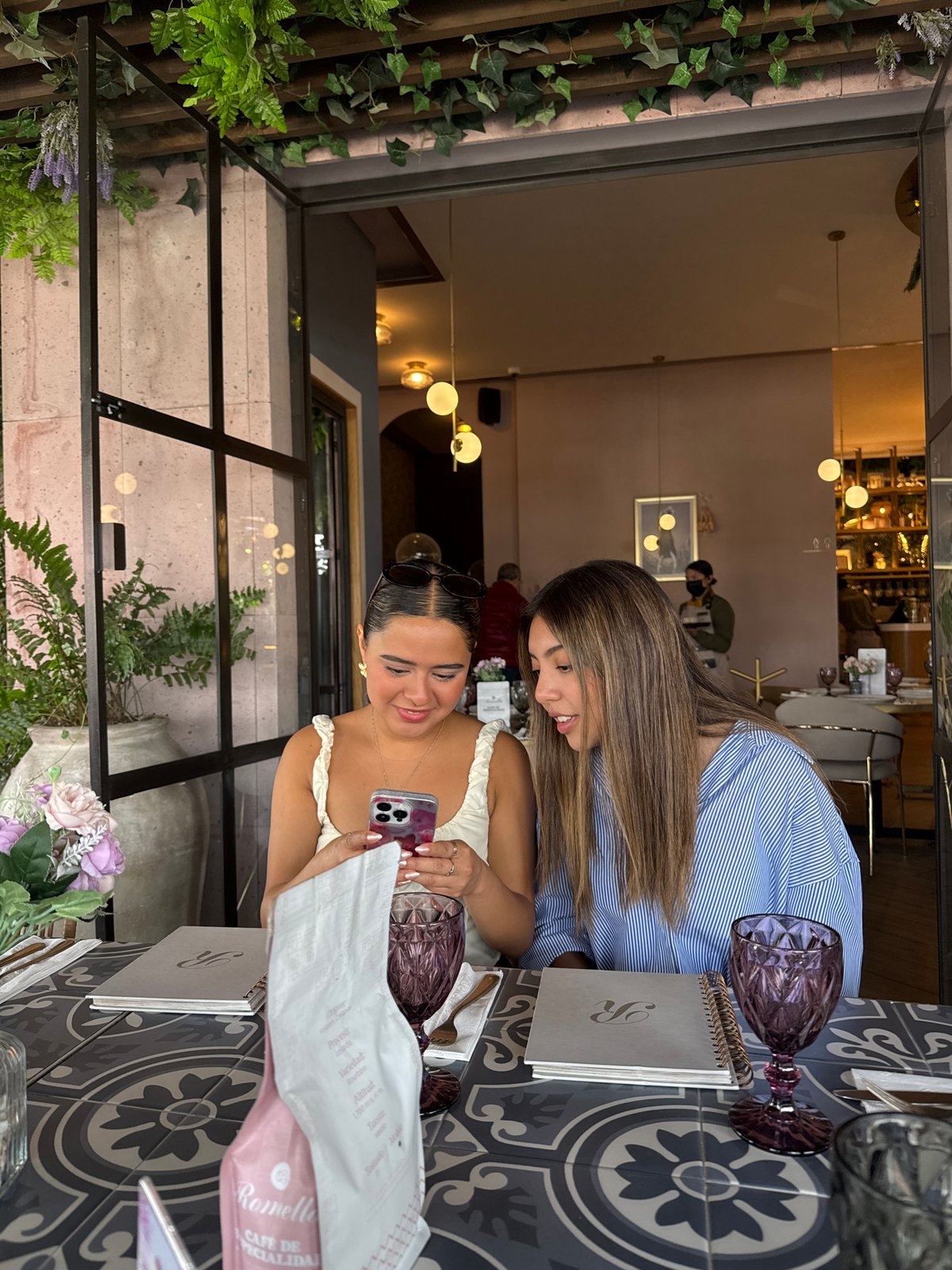 Young women share social dinner at Puebla restaurant