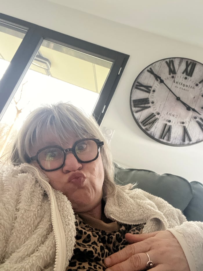Woman enjoys quiet Sunday at home with pets in France