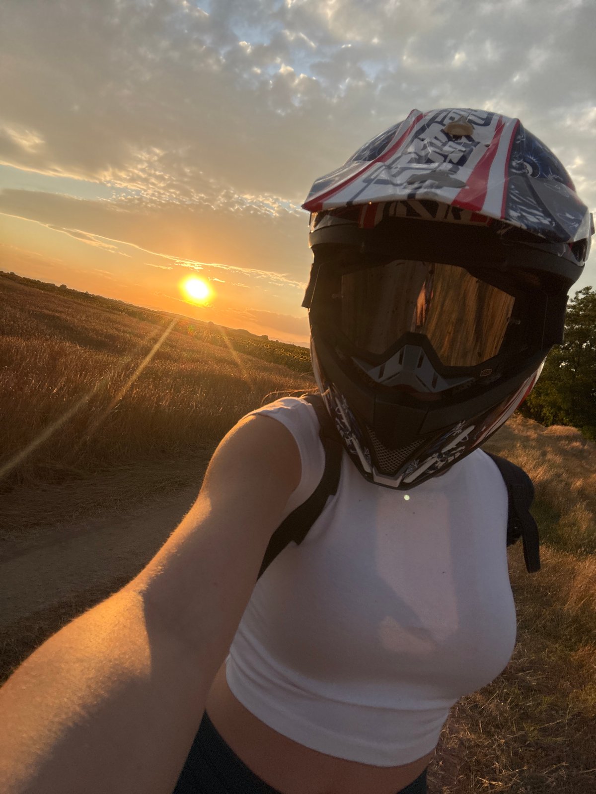 Motocross rider at sunset on a dirt path near Stroevo, Bulgaria