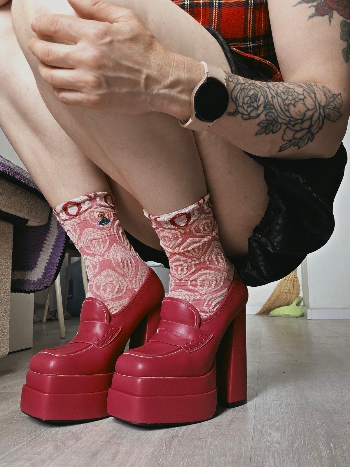 Person spotted wearing red platform loafers indoors in Saint Petersburg