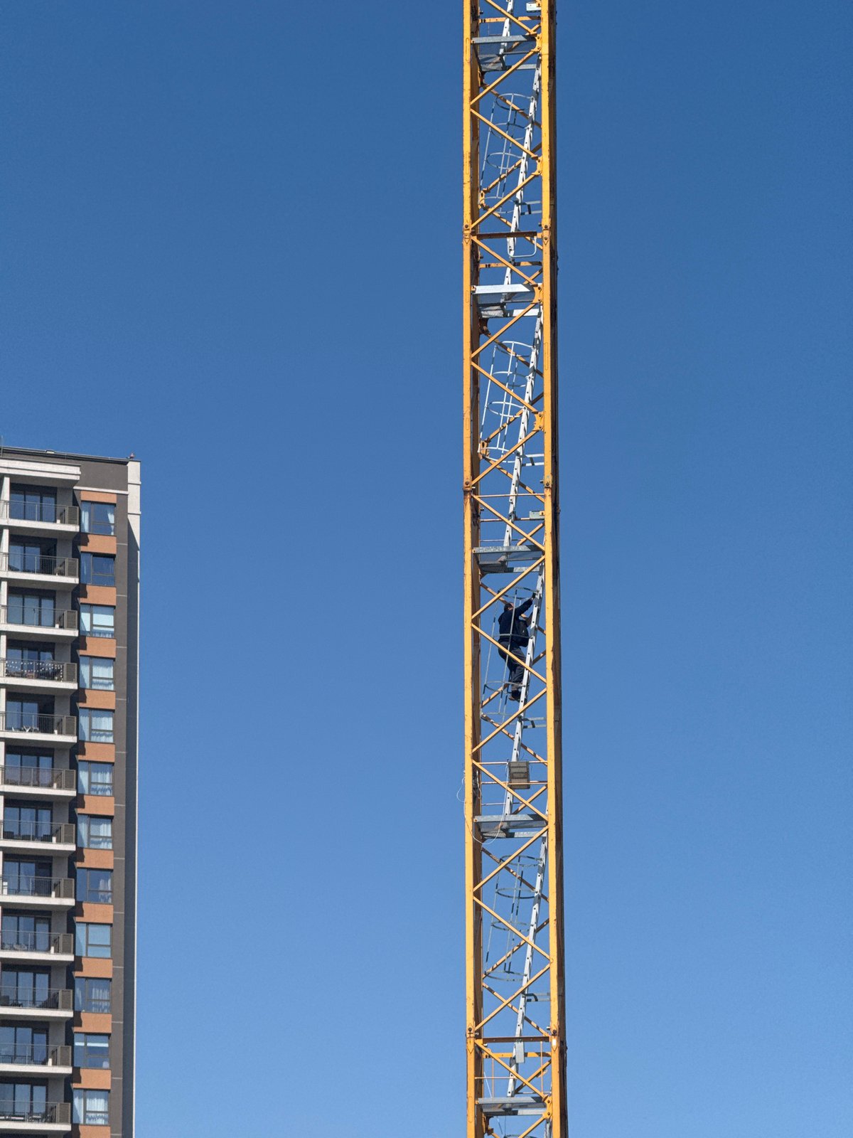 Skyscraper construction documented under clear skies in Belgrade