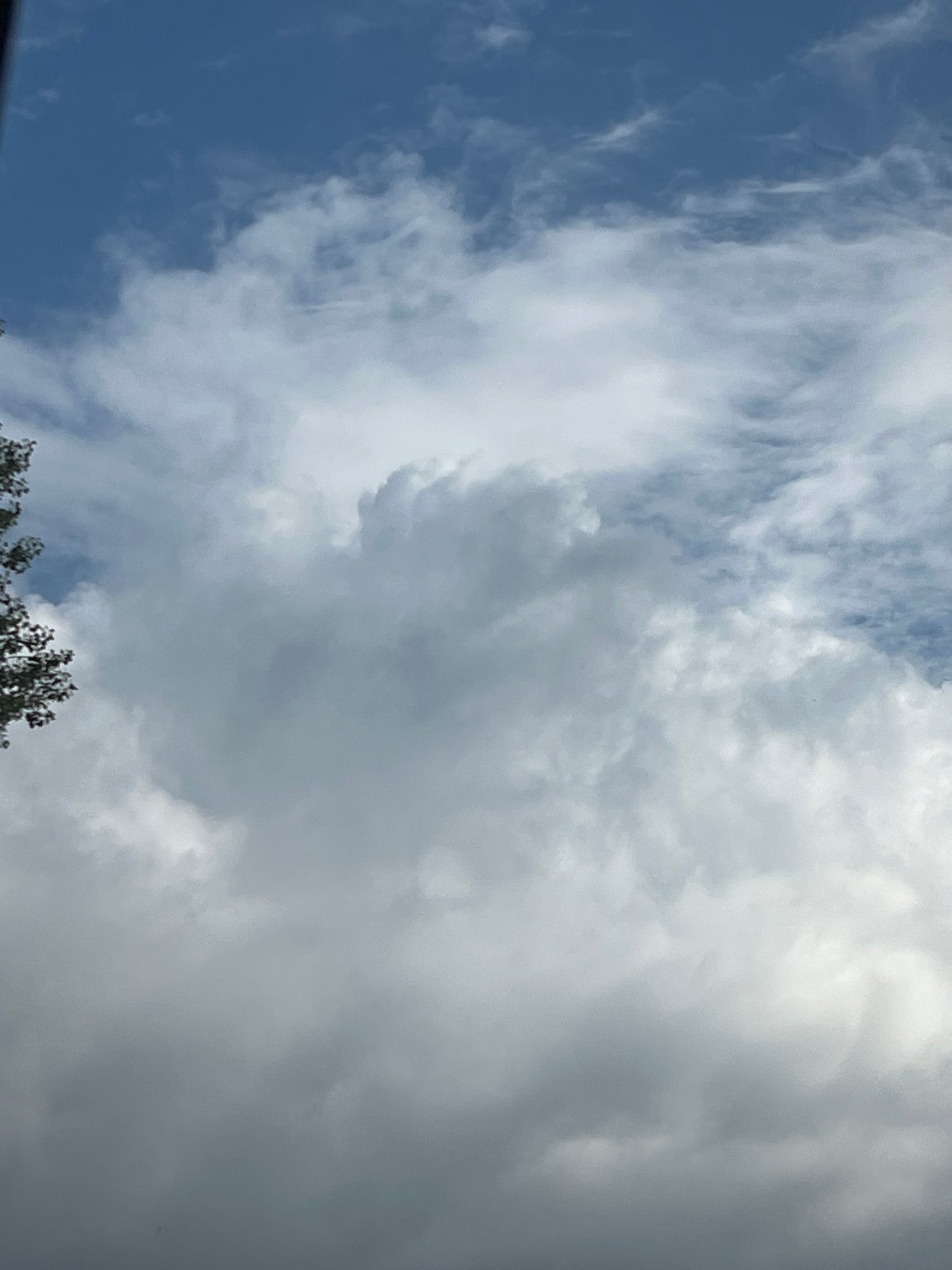 Warsaw morning sky turns stormy, captured from street and above