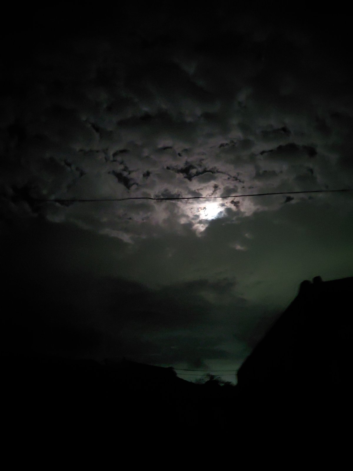 Cloudy night moon observed over Santa Ana, Venezuela