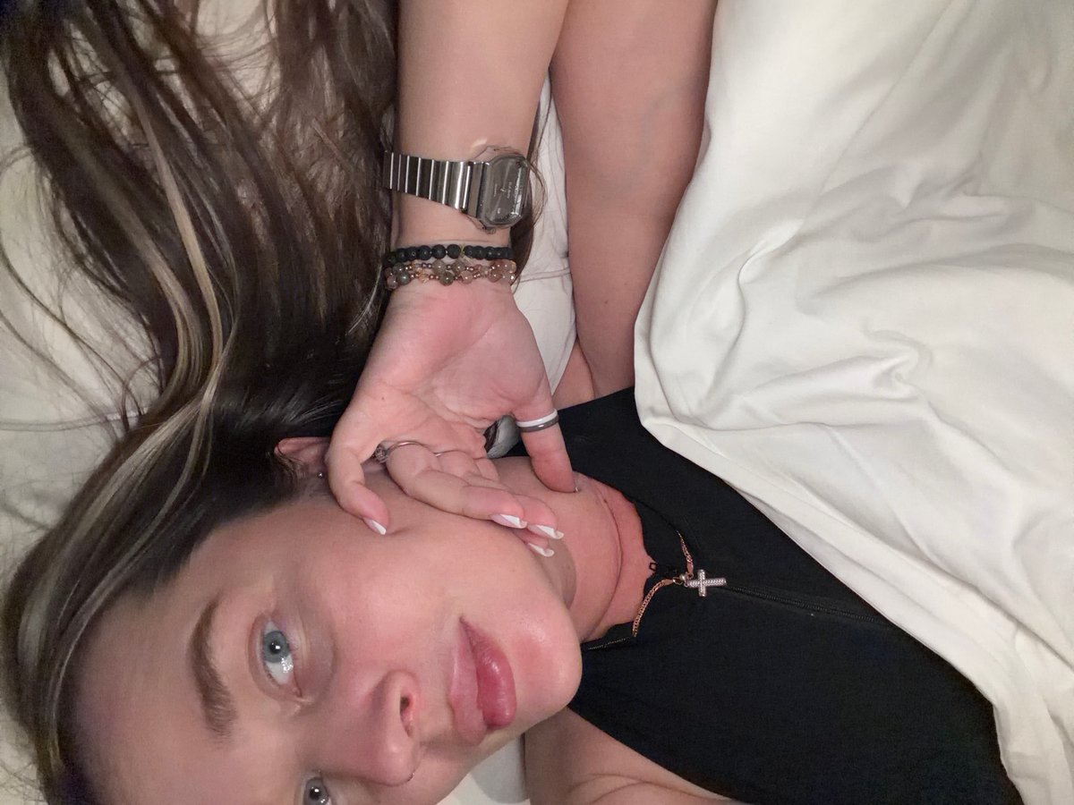 Woman rests on hotel bed in Moscow