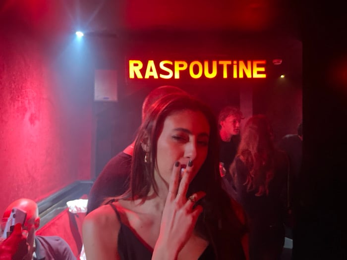 Woman smoking at Raspoutine nightclub in Paris early Saturday
