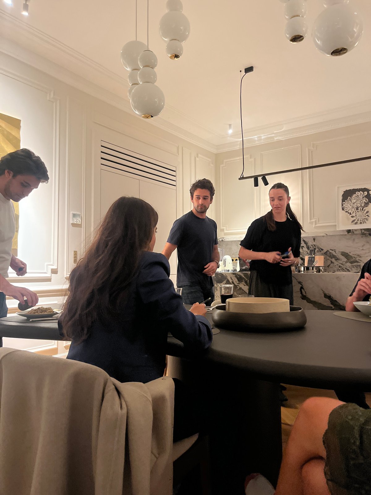 Four adults dine at Paris restaurant, risotto served