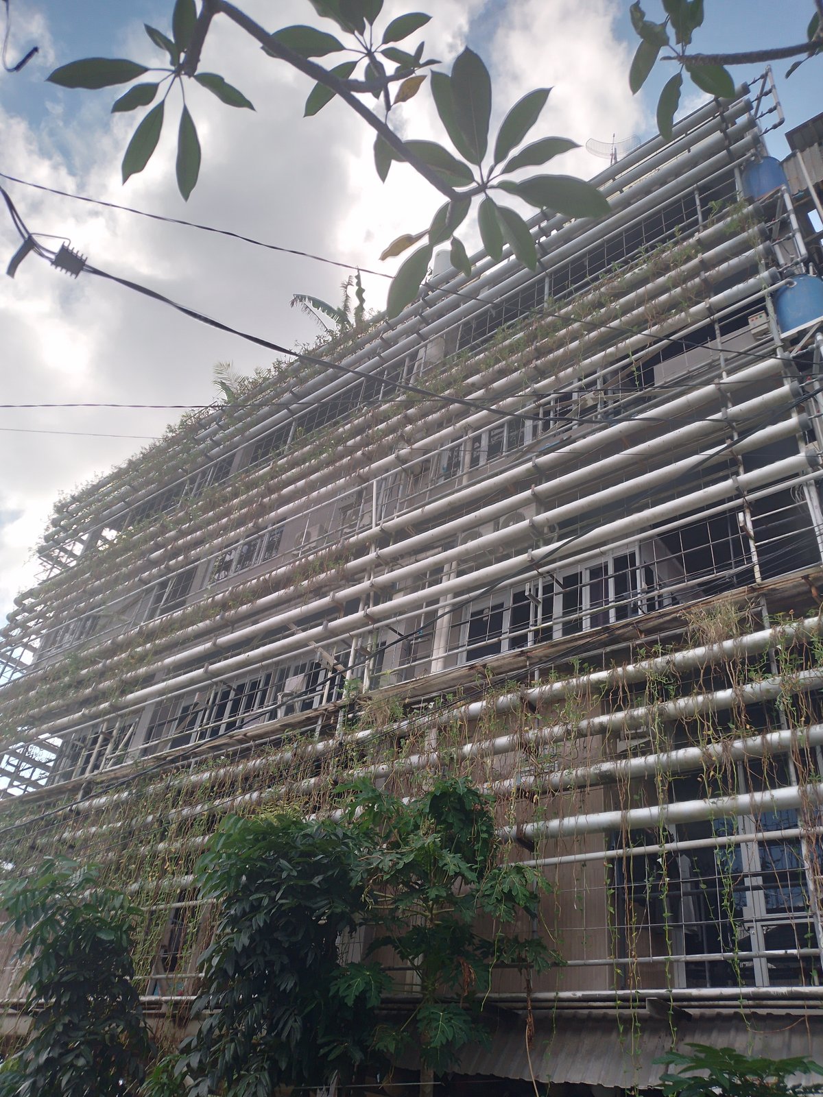 Building with silver vertical pipes documented in Kuta Selatan