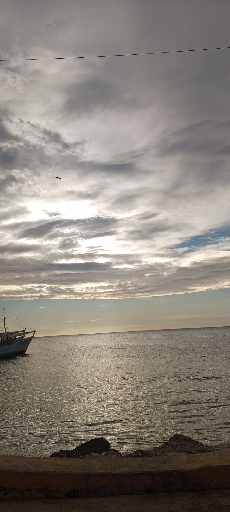 Juan Griego harbor at dusk, clouds and calm water