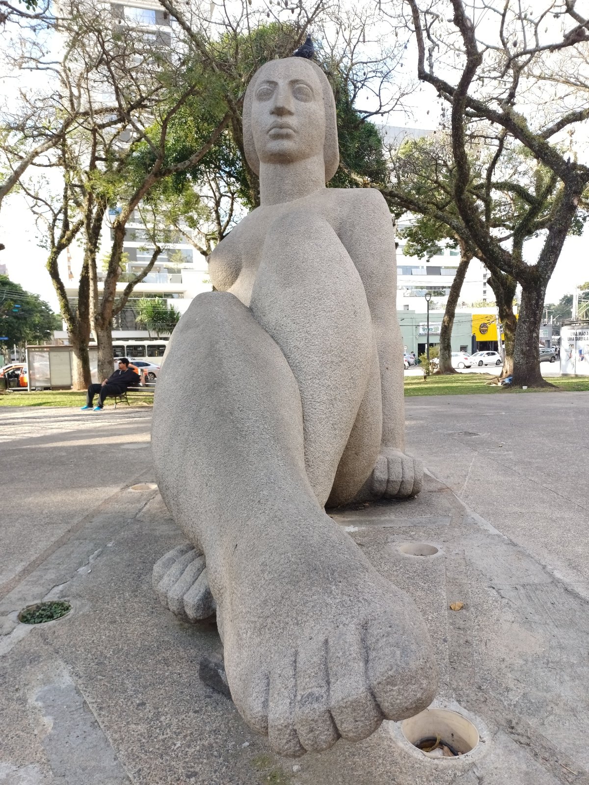Evening street life documented around Curitiba monuments and bike stations