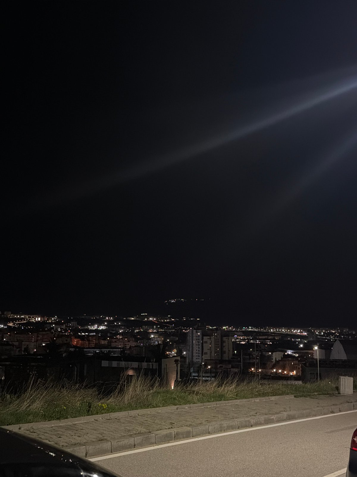 Nighttime panorama of Blagoevgrad captured from elevated roadside viewpoint