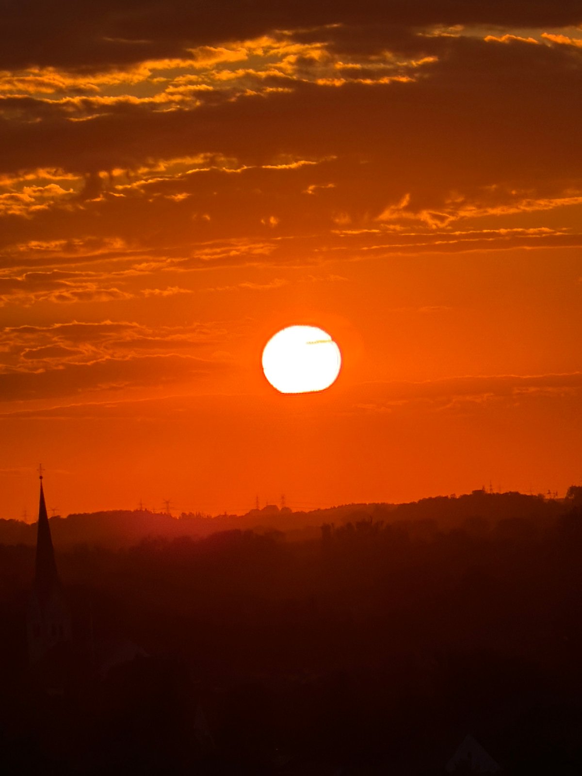 Munich sunset viewed from above, church spires in silhouette