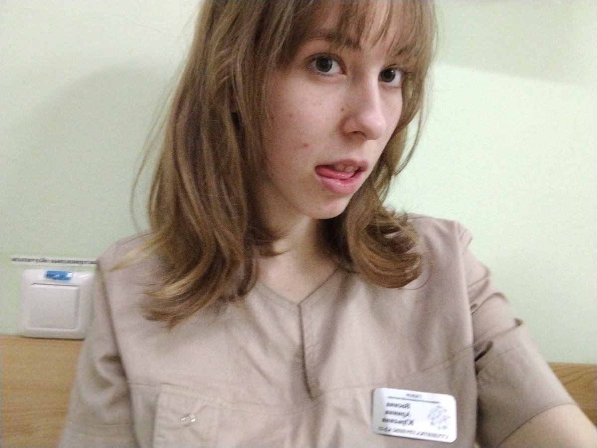 Woman in uniform makes playful gesture during work