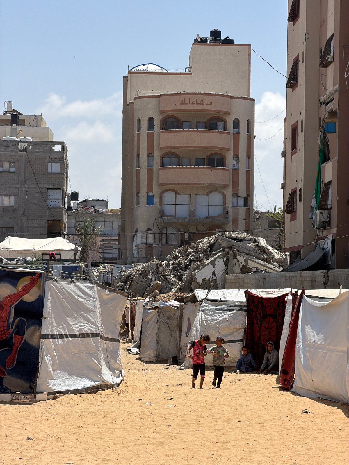 Makeshift displacement camps documented in Gaza under clear skies