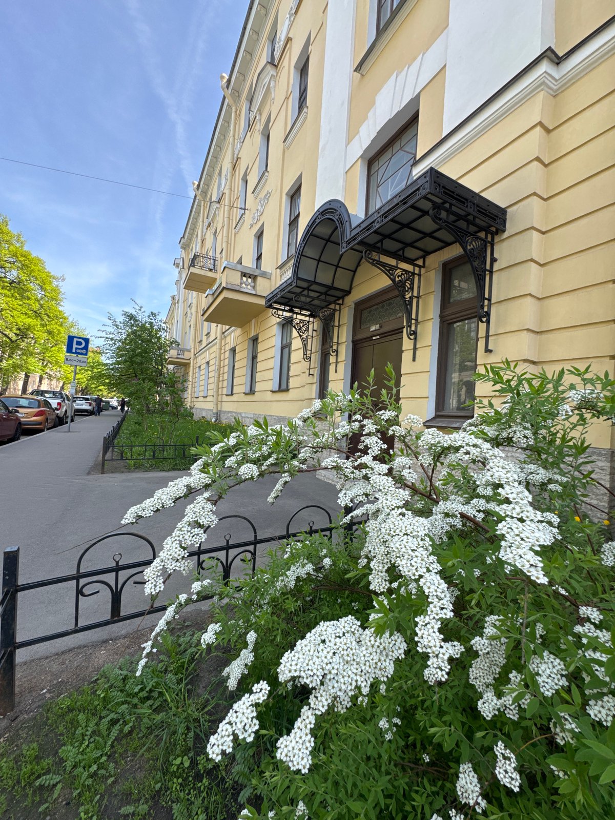 Tourist documents sunny morning walk through historic Saint Petersburg