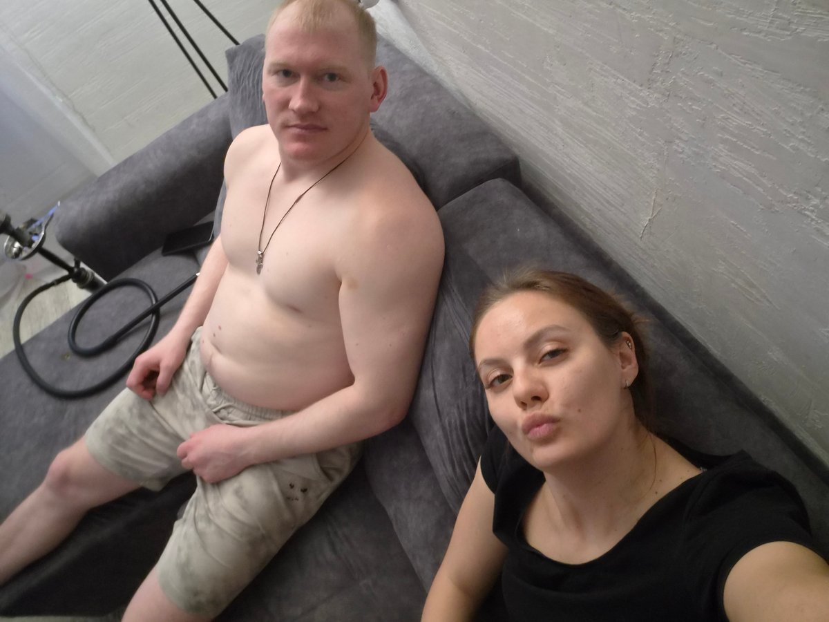 Couple photographed relaxing indoors in Chaikovsky, Russia