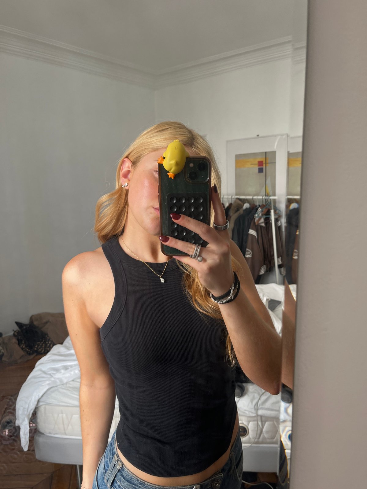 Person takes selfies with rubber duck phone in Paris