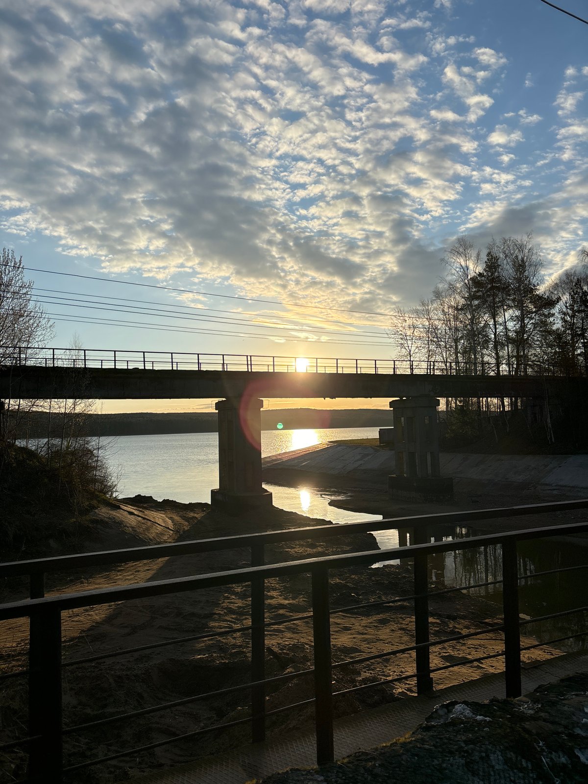 Dawn or dusk photographed over water near Chaikovsky bridge