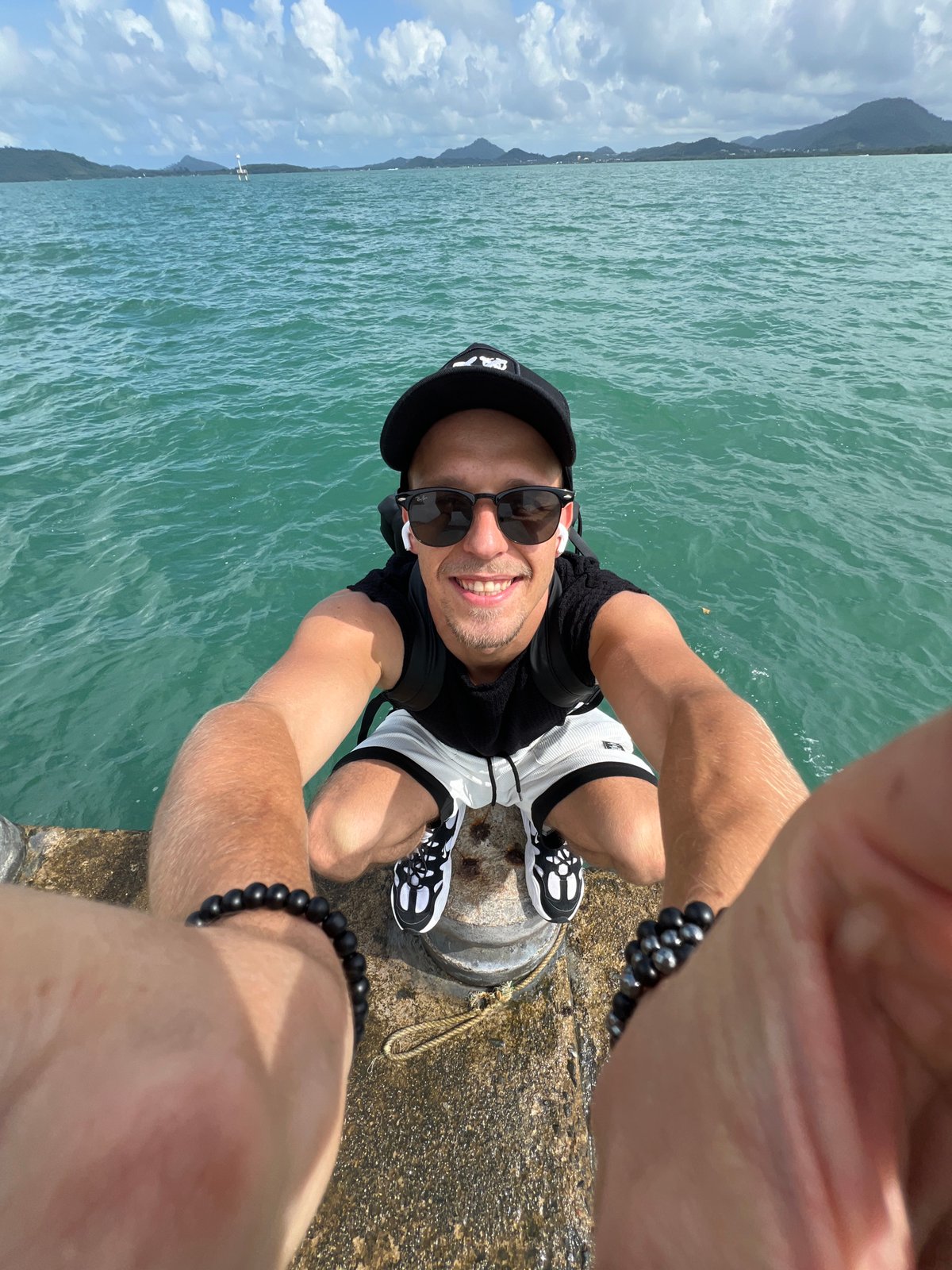 Morning at a Pa Khlok pier, boats and selfies on cloudy water