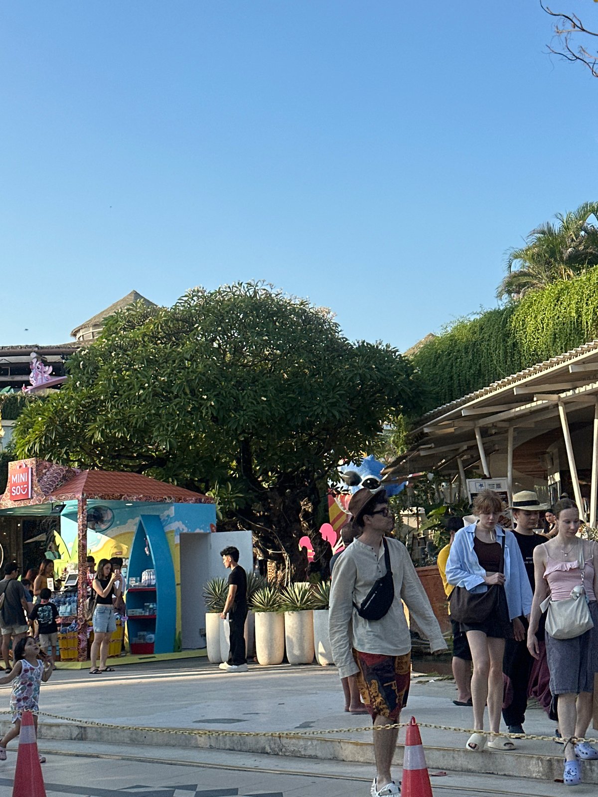 Morning activity along Kuta's beachfront strip and shopping area