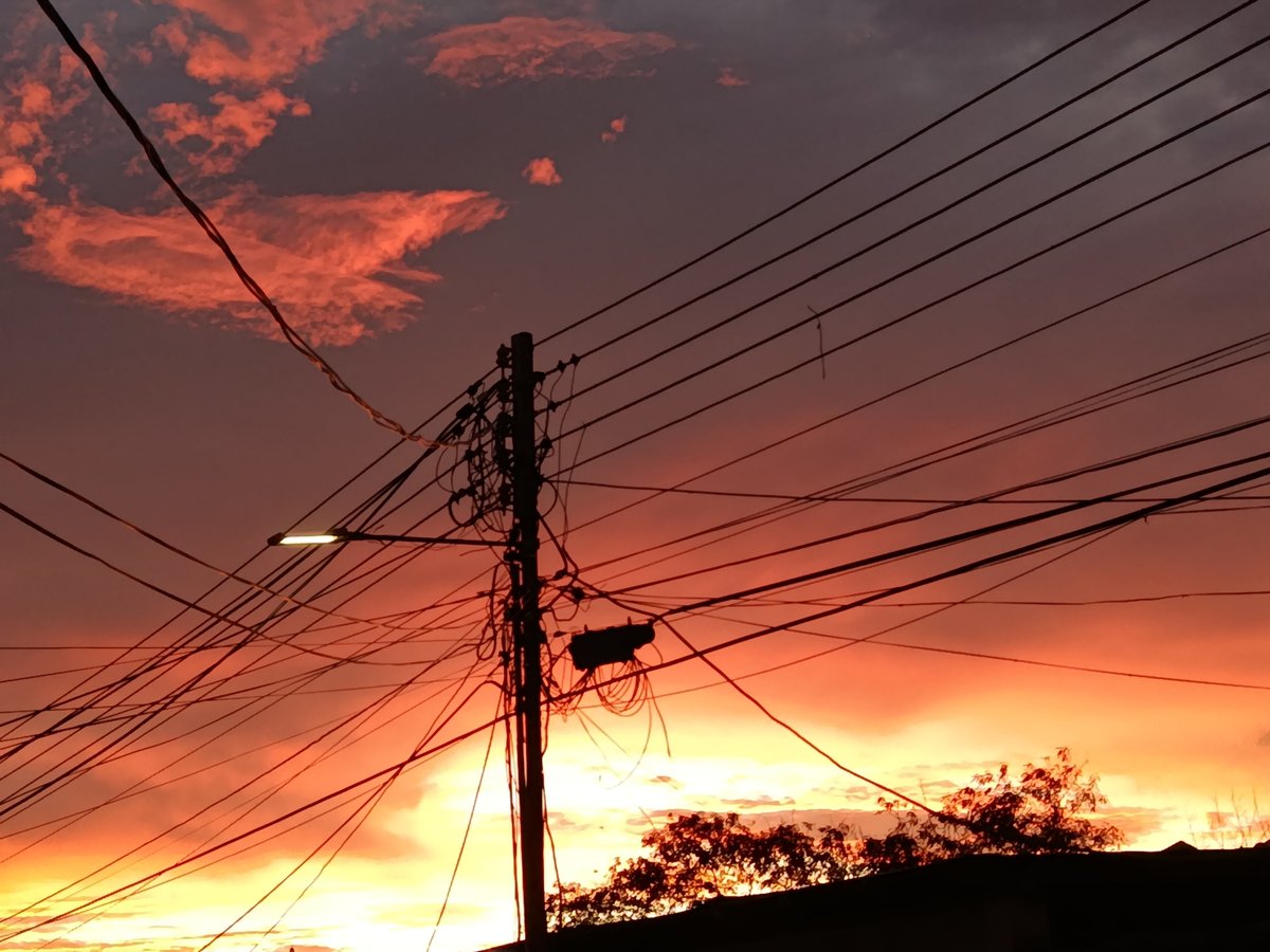 Sunset over Juan Griego streets, power lines and all