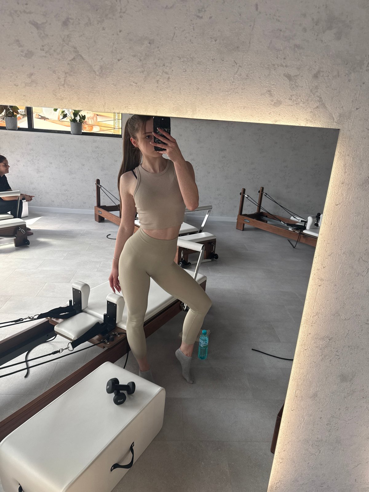 Woman Takes Mirror Selfie at Sofia Pilates Studio