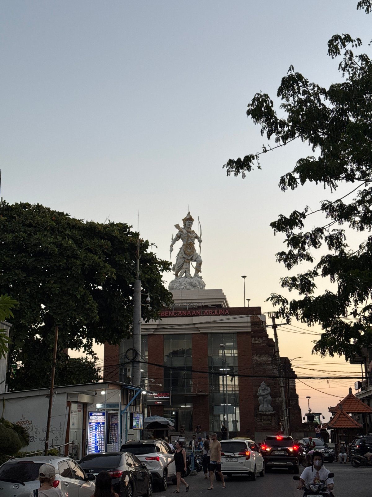 Kuta at golden hour: streets, beach, and sunset crowd