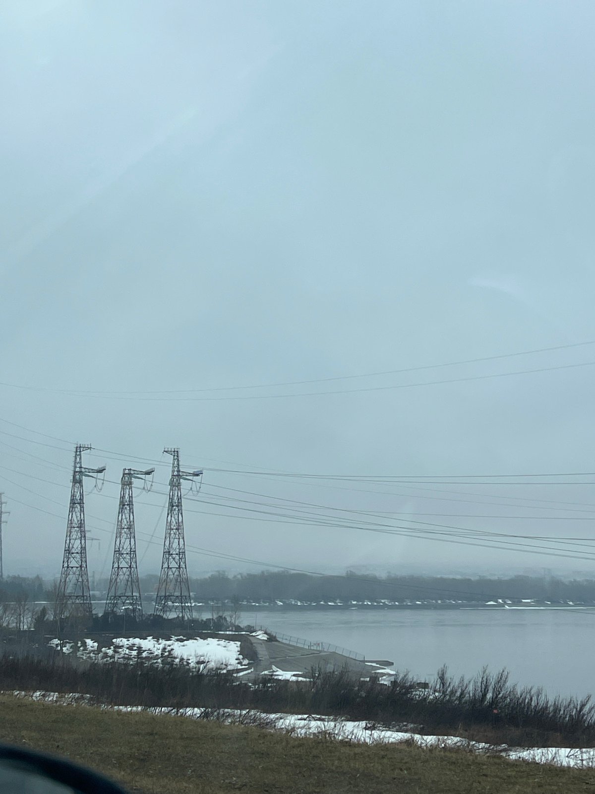Overcast morning scene with power towers near Kama River