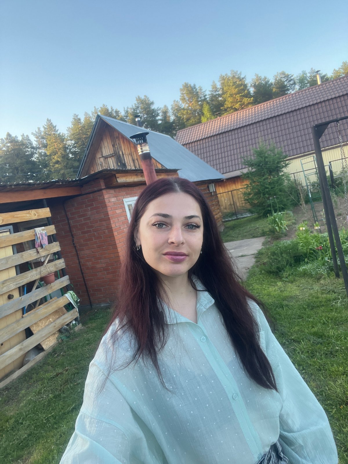 Woman documents spring garden and property in rural Russia