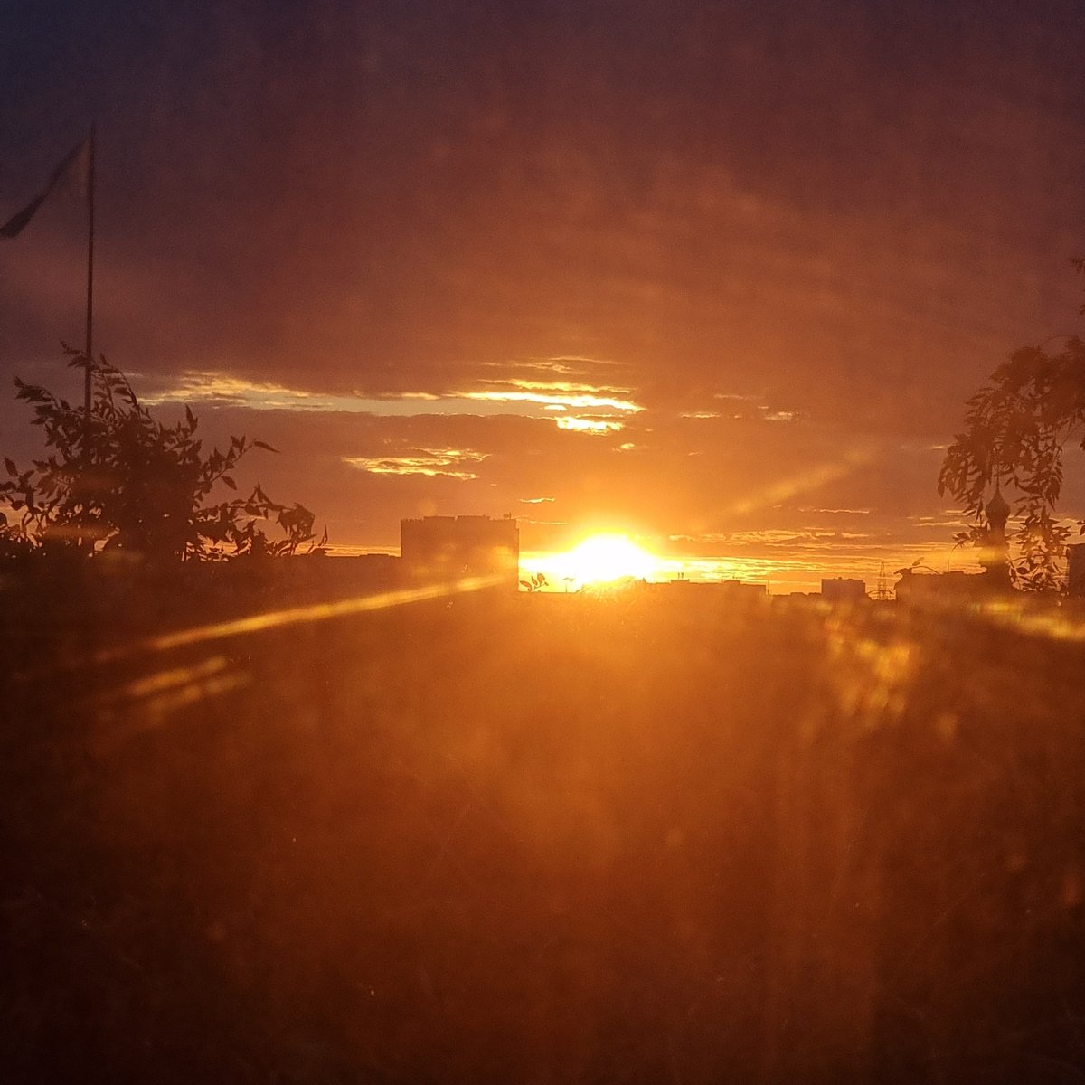 Vivid summer sunset colors the sky over Aktobe